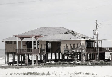 Wind damage - spray foam can help prevent uplift to Long Beach roofs